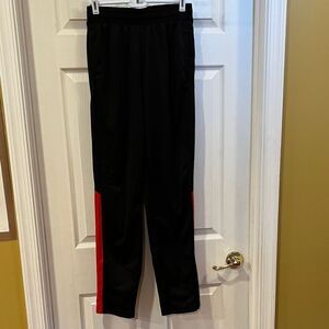 Athletic men’s size small black/red pants.
